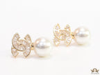 Golden cz baguettes studded twin C motif stud with pearl drop