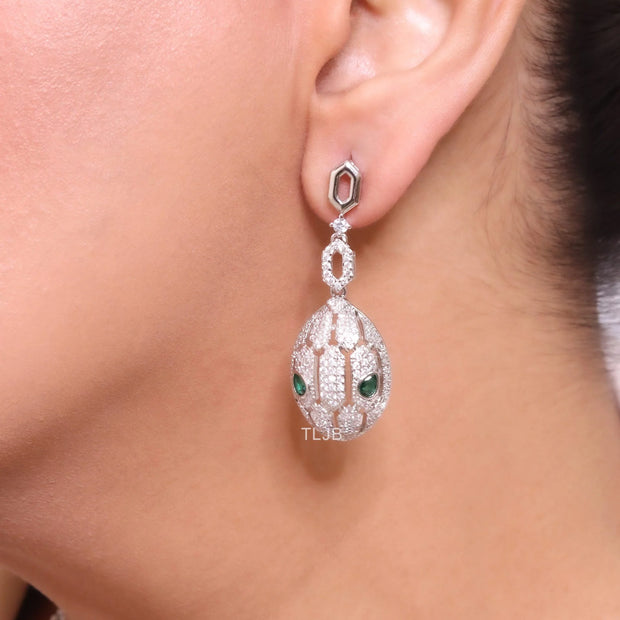 Platinum Snake head pendant set with emerald detailing