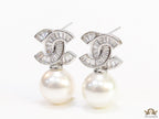 Platinum cz baguettes studded twin C motif stud with pearl drop