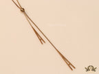 A initial sling necklace in gold finish