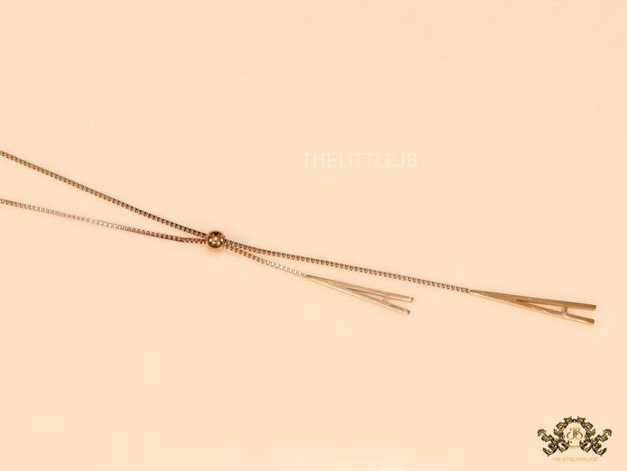A initial sling necklace in gold finish
