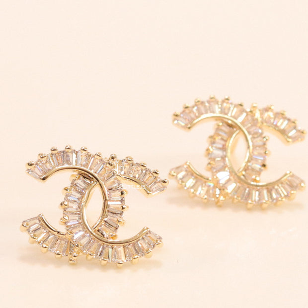 Gold plated twin C motif studs in cz baguettes