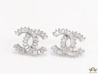 Platinum plated twin C motif studs in cz baguettes