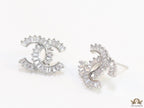 Platinum plated twin C motif studs in cz baguettes