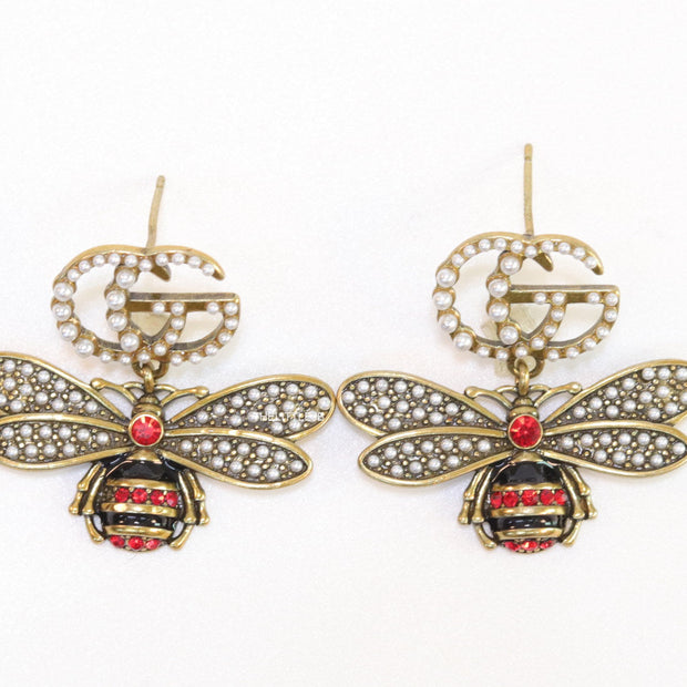 Gold plated twin G cz earrings with honey bee motif drop