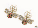 Gold plated twin G cz earrings with honey bee motif drop