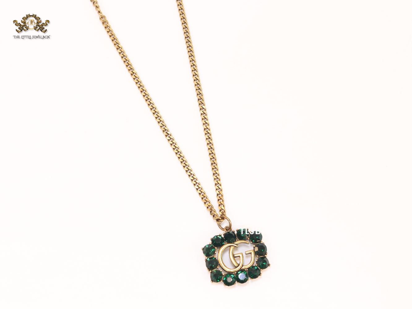 Rustic double g with green stones