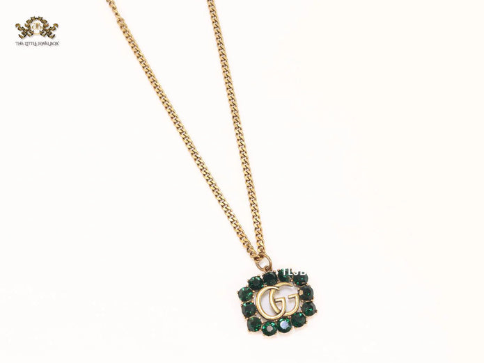 Rustic double g with green stones
