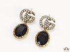 Rustic double G earings with oval black drop