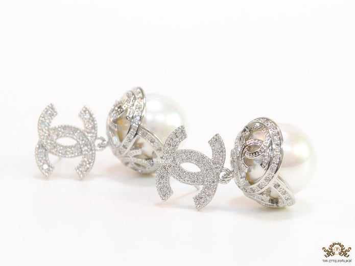 Platinum plated twin C earrings in cz with cz capped pearl drop