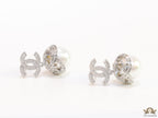 Platinum plated twin C earrings in cz with cz capped pearl drop