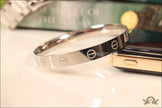 Men's bracelet with screws in platinum finish
