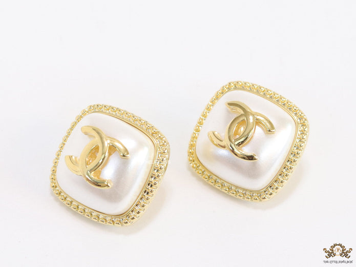 Twin C motif square studs in golden and MOP finish