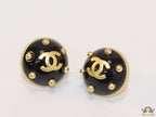 Black and golden twin C motif round stud earrings