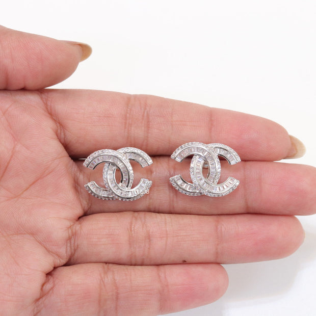 Platinum plated cz studs in twin C motif