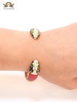 Two snake head red leather bracelet