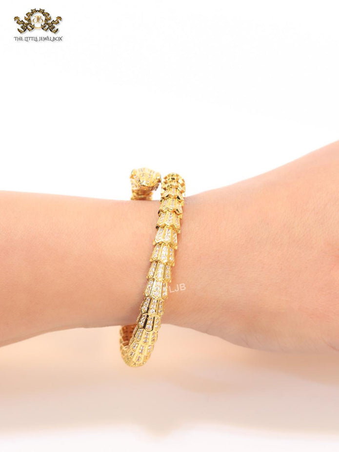 Gold serpentine and cz bracelet