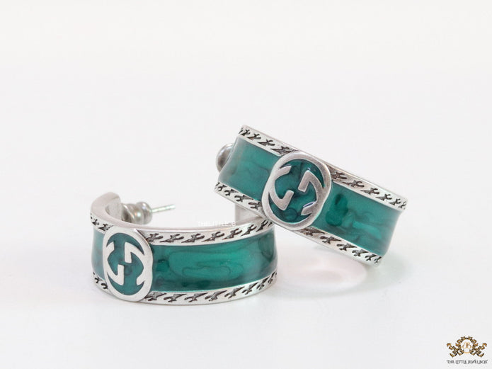 Blue green platinum studs with twin G motif
