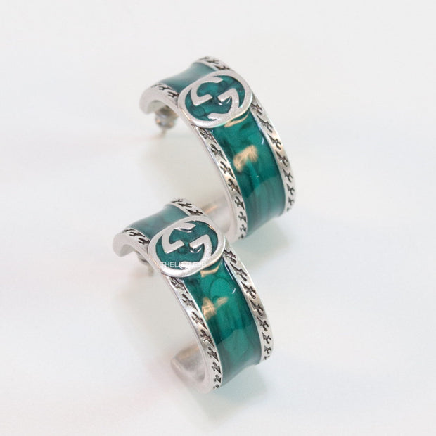 Blue green platinum studs with twin G motif