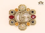 Double G embossed rustic brooch with multi coloured stones