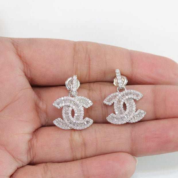 Platinum plated cz dangle earrings with twin C motif