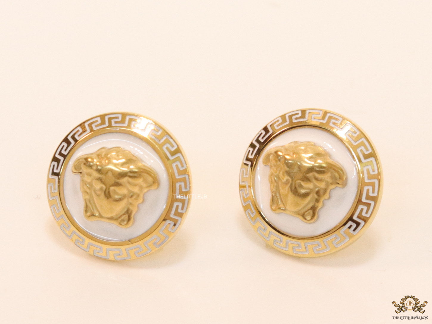 Golden 3D Medusa motif on white base and golden details studs