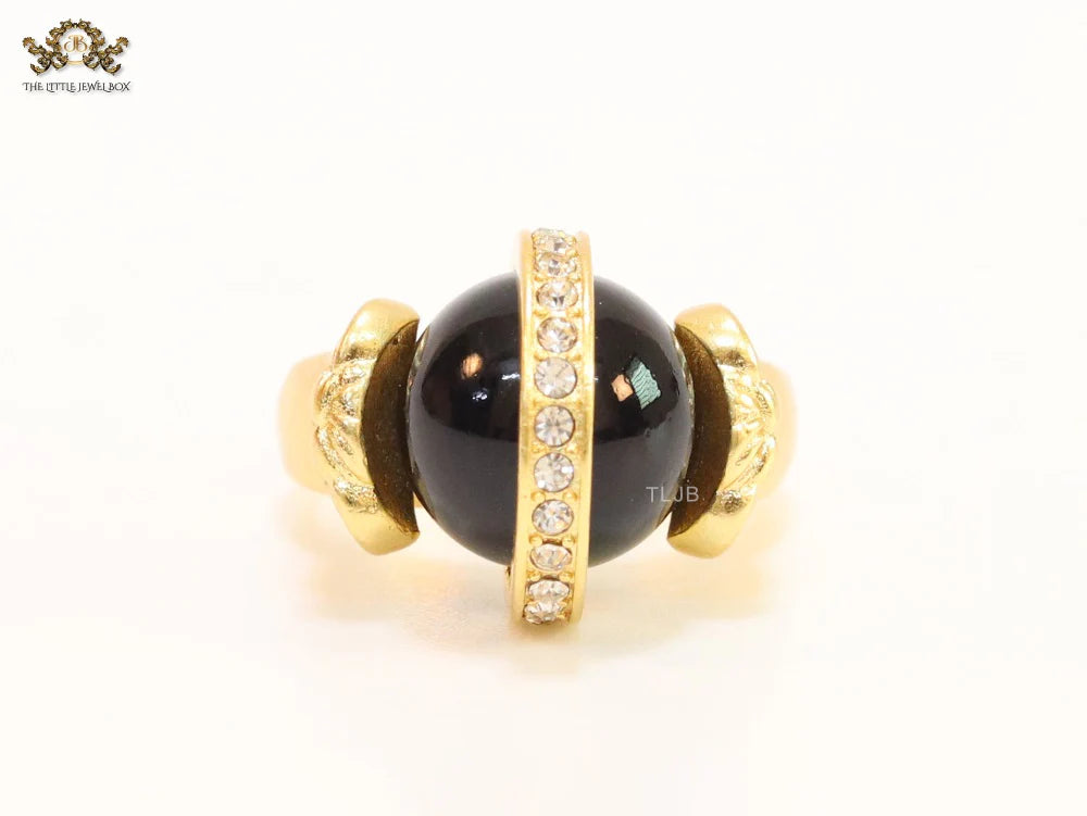 Double gold Medusa with CZ on black ball ring