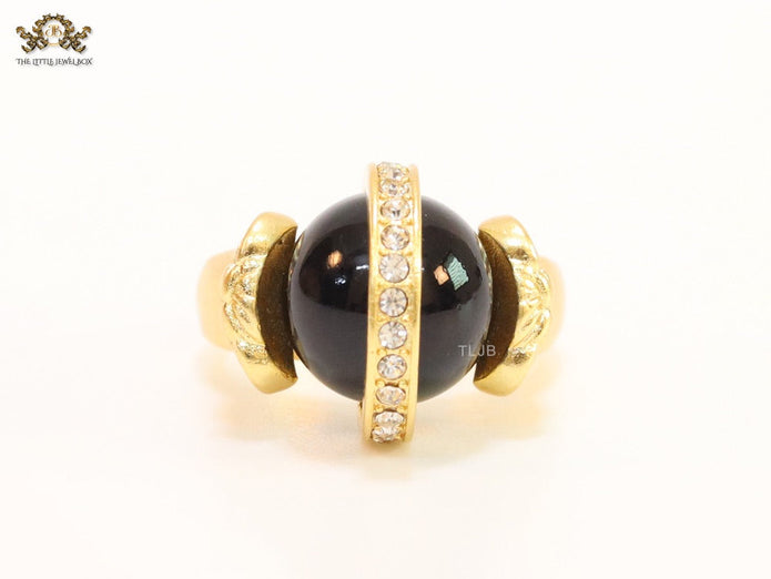 Double gold Medusa with CZ on black ball ring
