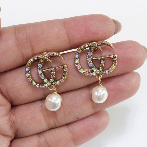 Double G golden earrings with multi color cz stones and pearl