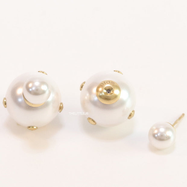 White pearl studs with golden alphabet motif and golden details