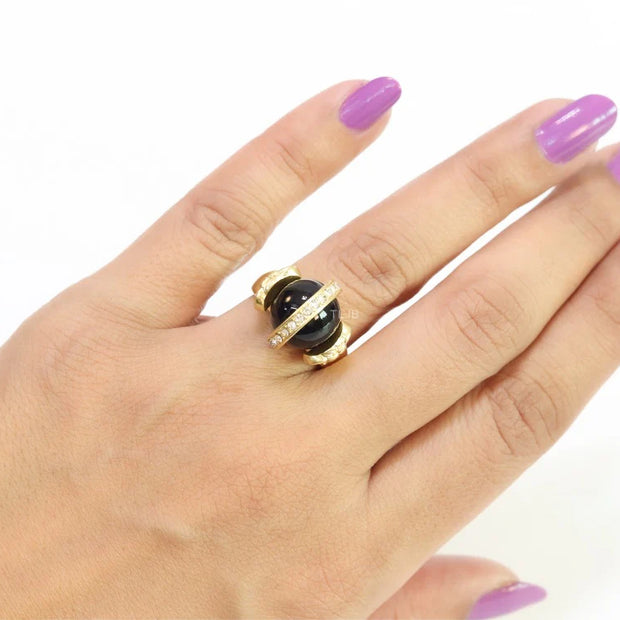 Double gold Medusa with CZ on black ball ring