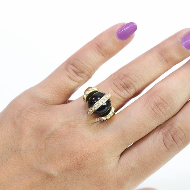 Double gold Medusa with CZ on black ball ring