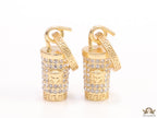 Gold plated hoop with cubic zirconia and 3d golden Medusa motif on cylidrical drop.