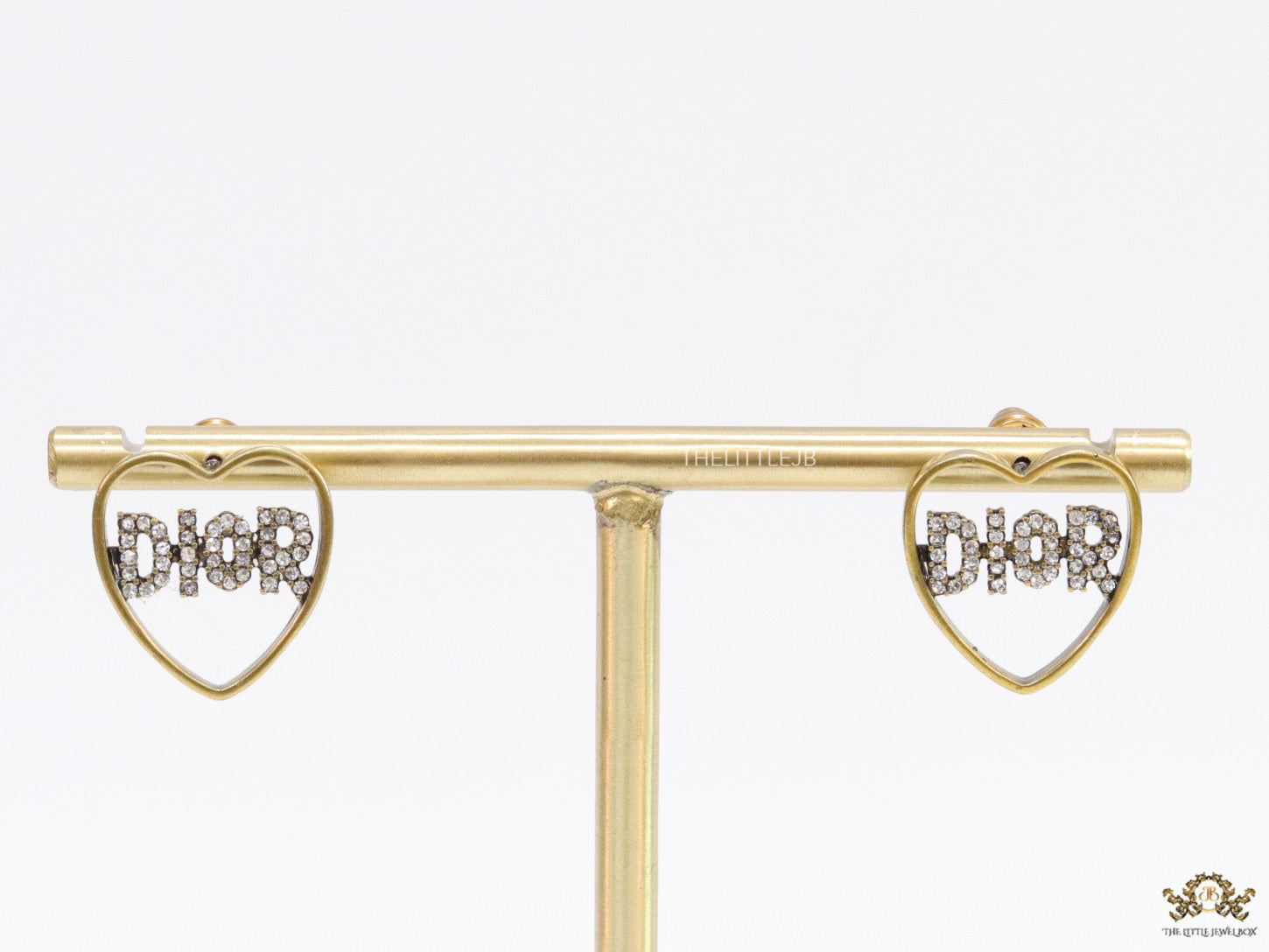 Matt gold plated heart shaped earrings with cz alphabets