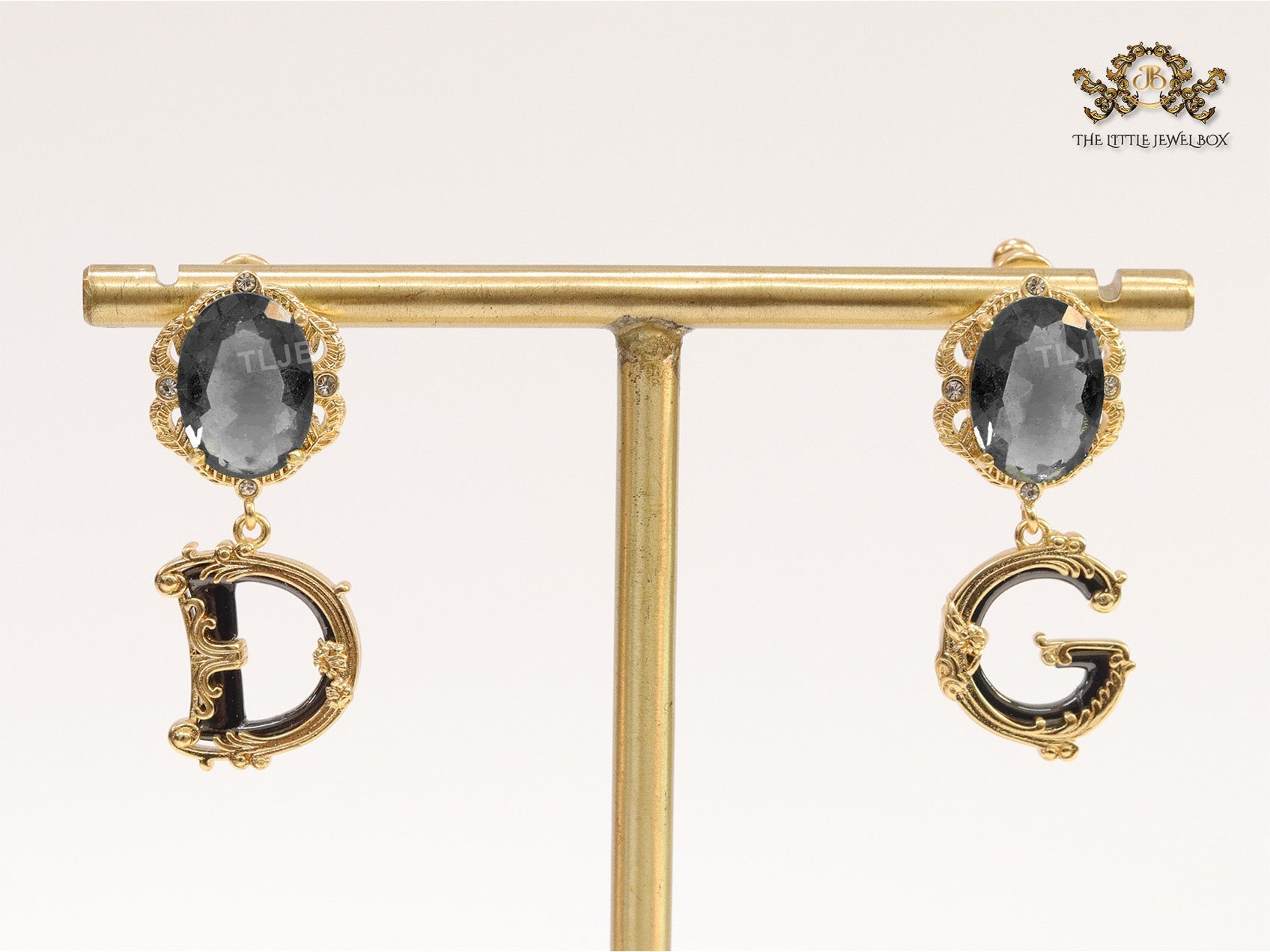 Semi-precious black stone with gold plated detailed with black and golden alphabet drop