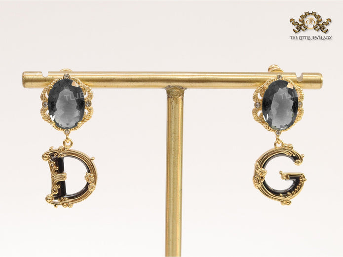 Semi-precious black stone with gold plated detailed with black and golden alphabet drop