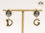 Semi-precious black stone with gold plated detailed with black and golden alphabet drop