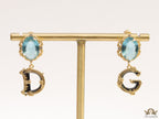 Semi-precious blue stone with gold plated detailed with black and golden alphabet drop