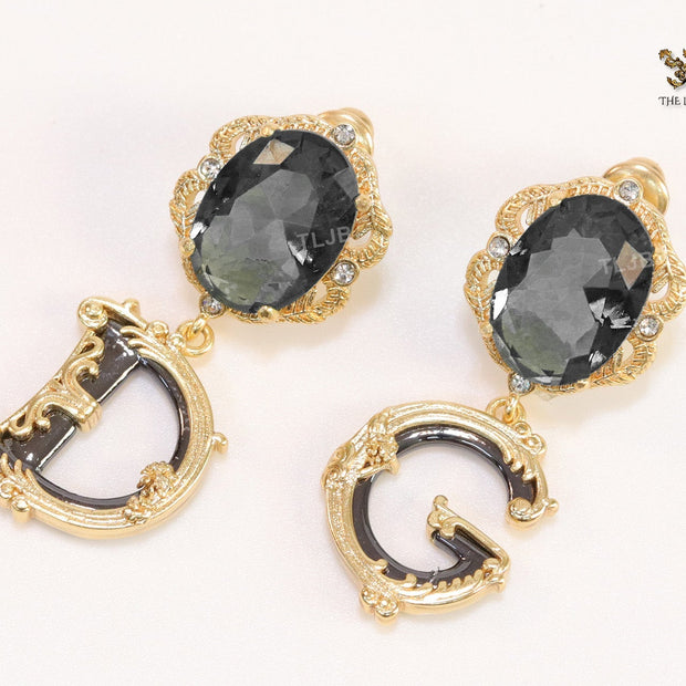 Semi-precious black stone with gold plated detailed with black and golden alphabet drop