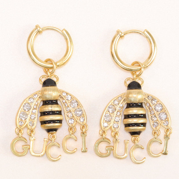 Simple gold plated hoops with golden and cubic zirconia stone queen bee and alphabets