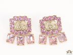 Lavender stone studes with gold plaetd double G motif and lavender stone drop