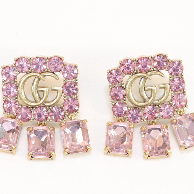 Lavender stone studes with gold plaetd double G motif and lavender stone drop