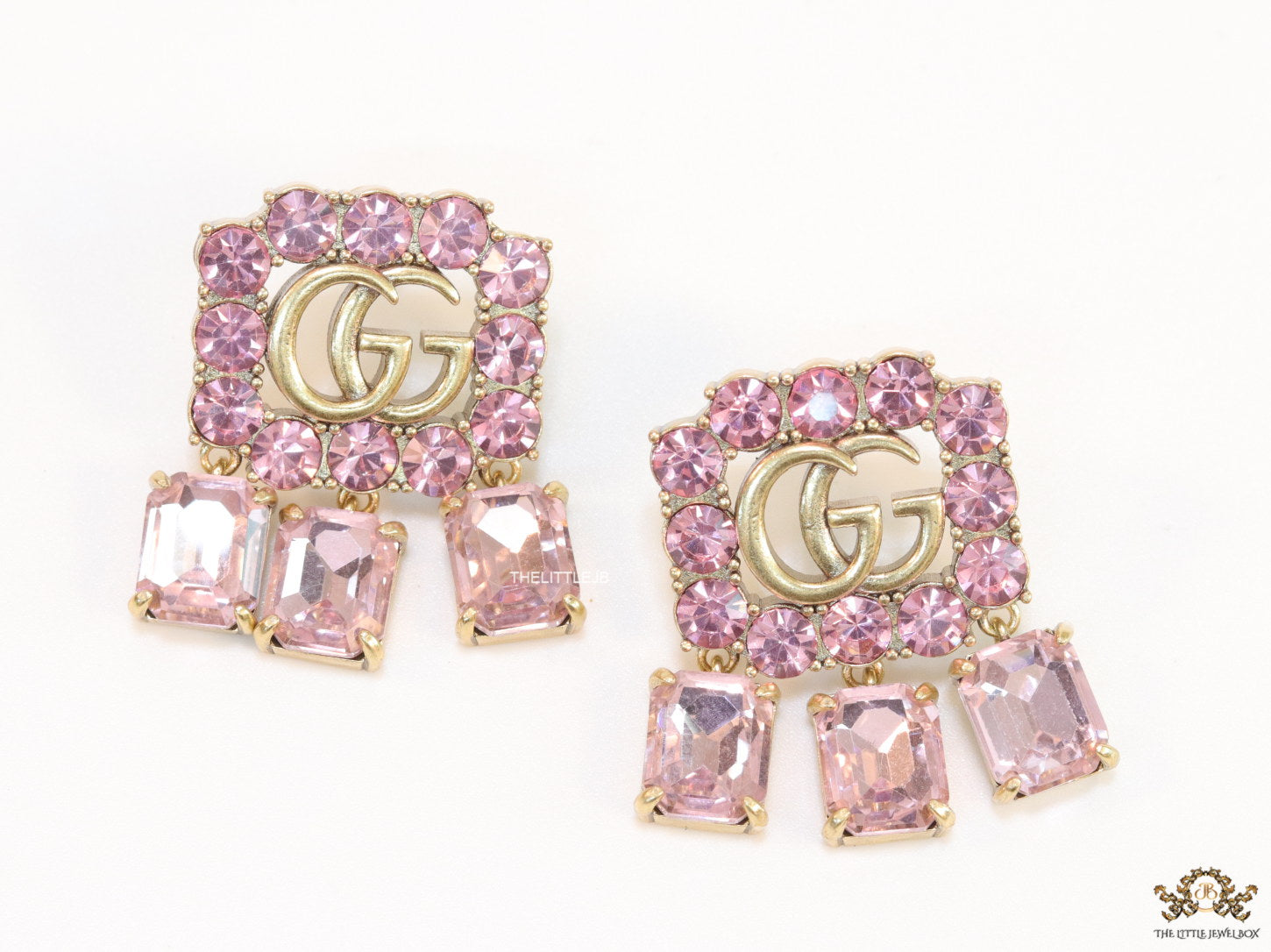 Lavender stone studes with gold plaetd double G motif and lavender stone drop