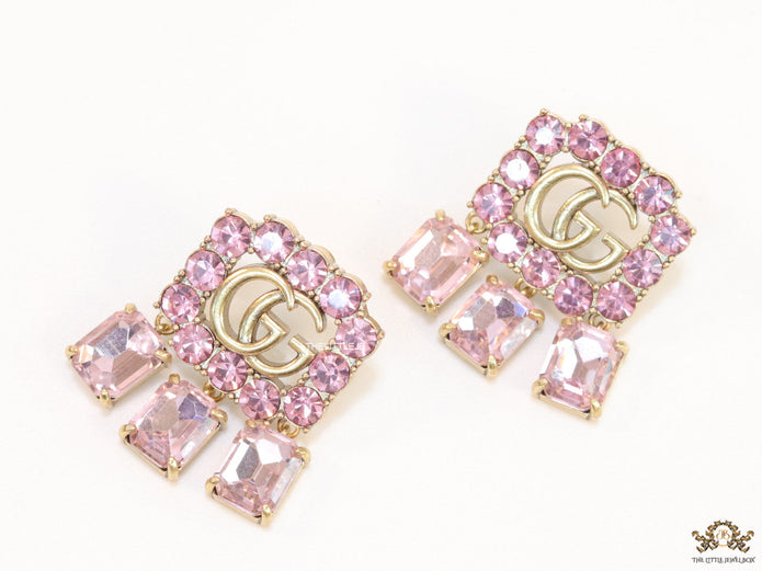 Lavender stone studes with gold plaetd double G motif and lavender stone drop
