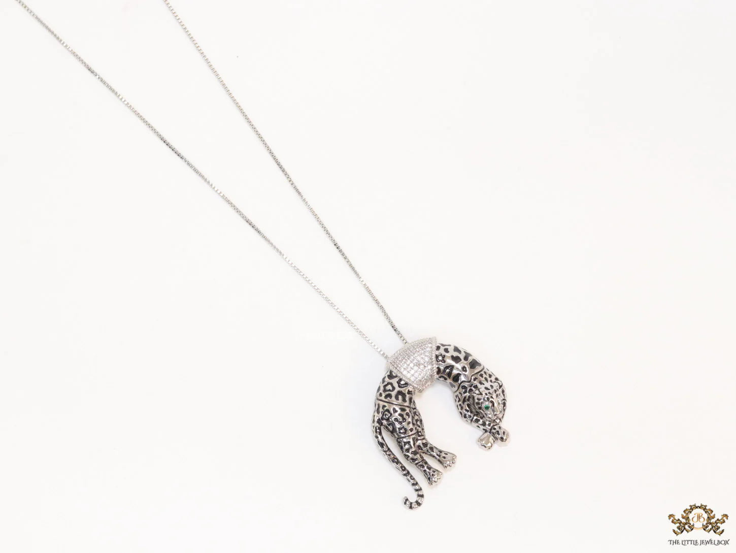 Platinum plated resting leopard pendant with cubic zirconia and Platinum chain