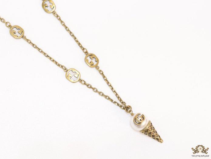 Antique gold plated alphabet motif chain with golden cone pendant