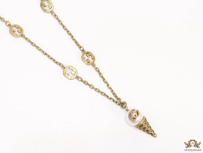 Antique gold plated alphabet motif chain with golden cone pendant