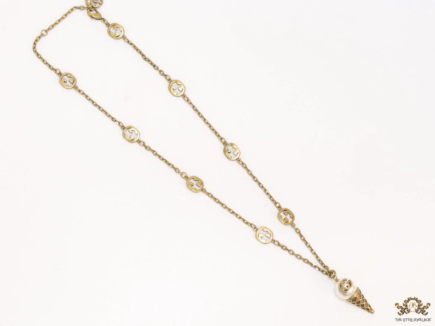 Antique gold plated alphabet motif chain with golden cone pendant