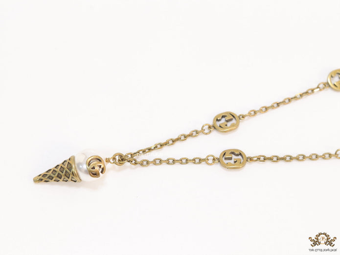 Antique gold plated alphabet motif chain with golden cone pendant