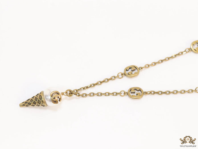 Antique gold plated alphabet motif chain with golden cone pendant